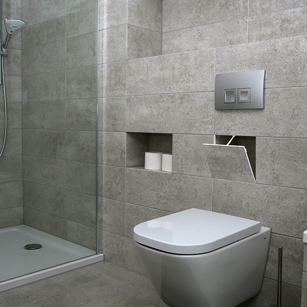 tile door inspection hatch installed in a bathroom